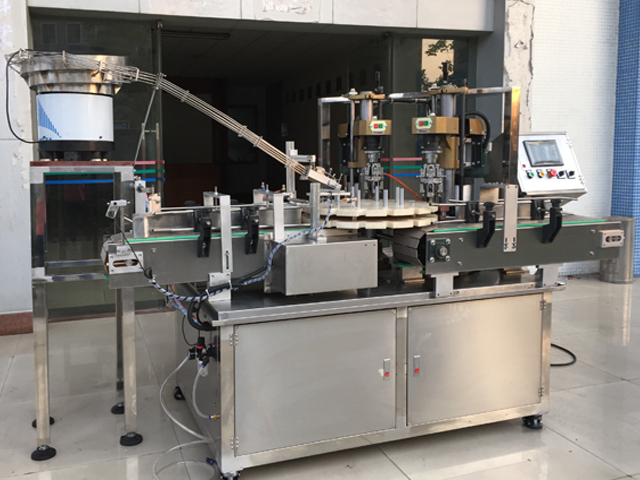 capping machine with 2 capping heads ឧបករណ៍វីសស្ពឺ semiauto.jpg