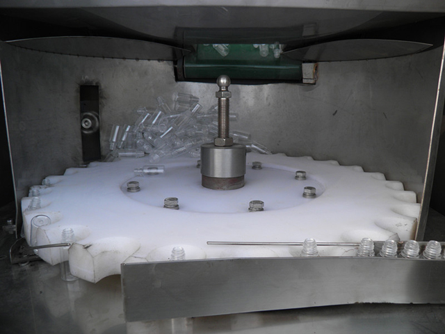 ឧបករណ៍តម្រៀបដប unscrambler.jpg