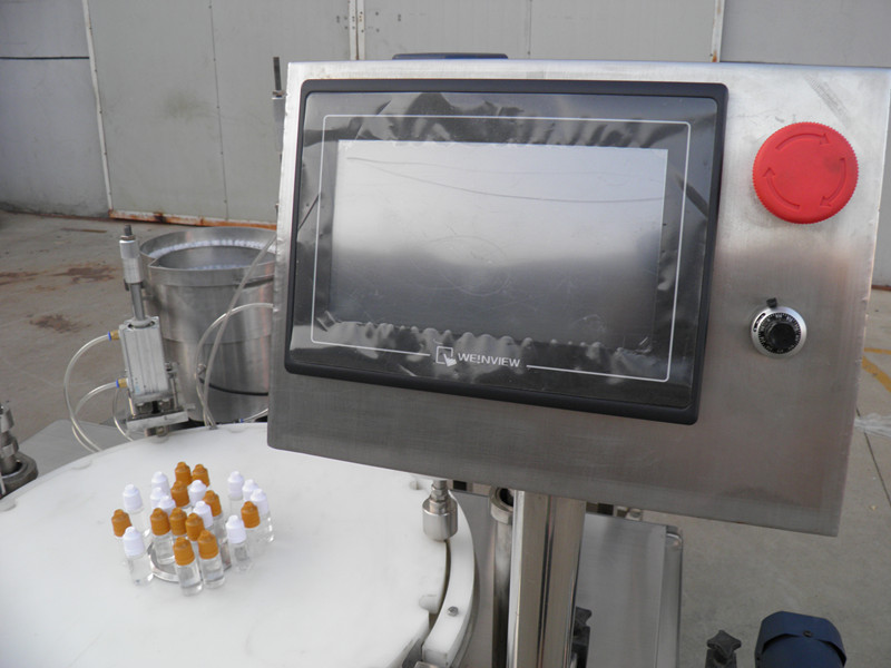 filling plugging capping labeling production line E liquid PLC bottle filler capping labeling.jpg