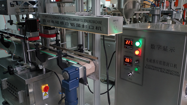 aluminum induction foil sealing machine ម៉ាស៊ីនផ្សាភ្ជាប់ automatic.jpg
