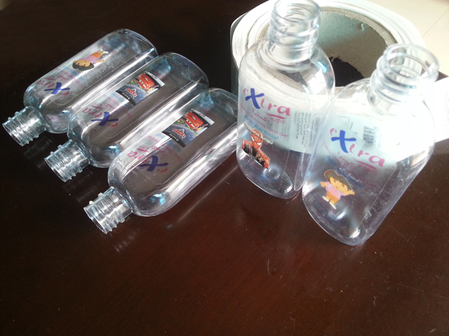 transparent labels labelled samples bottles plane surface Mrwan គំរូស្លាកថ្លា និងដប (3.jpg