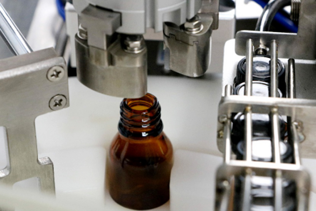 ម៉ាស៊ីនបំពេញដបប្រេង tabletop.jpg